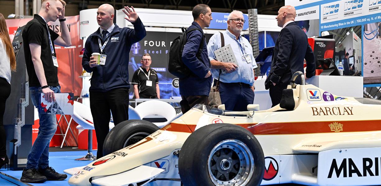 People standing around an F1 car