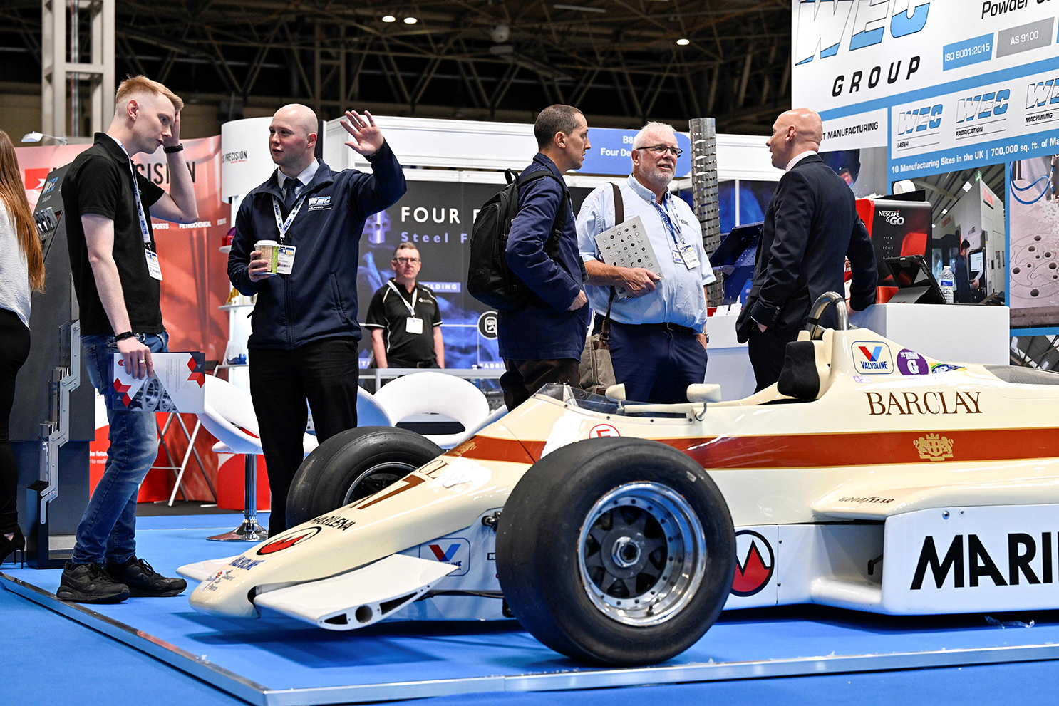 People standing around an F1 car