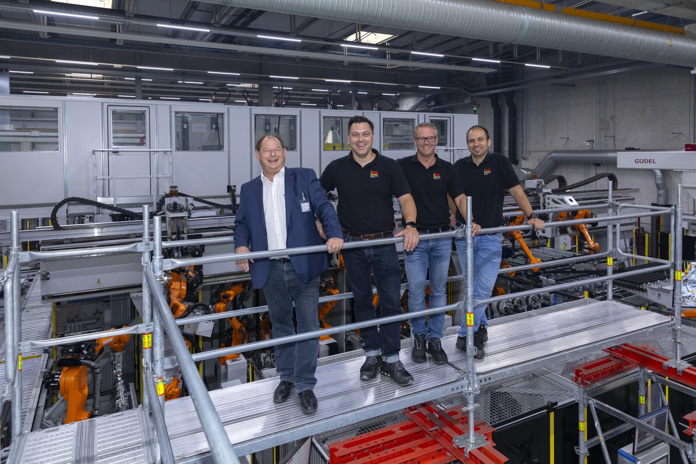From left to right: Roland Hermann; Christian Merkle (Production Manager), Stephan Schraml (Head of Technology Centre) and Wolfgang Urban (Project Manager) at PERI when the robots were commissioned. (Source: Yaskawa.)