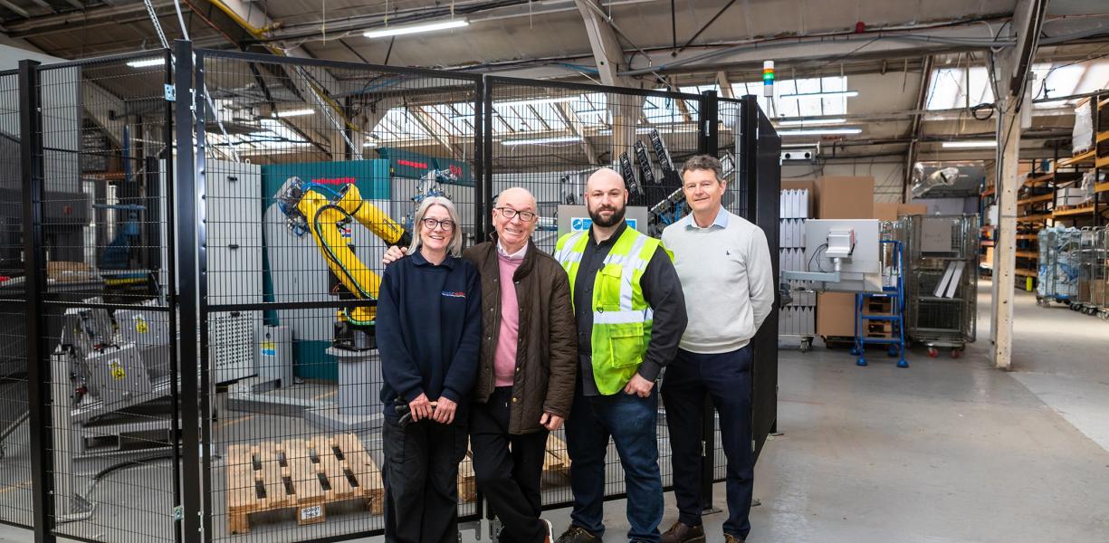 The Penn Elcom team in front of its new robotised bending cell.